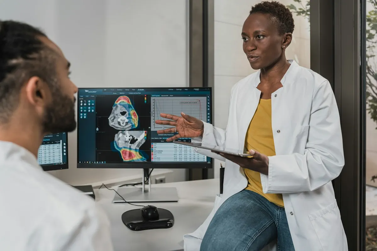 Clinician reviewing a patient scan on a monitor